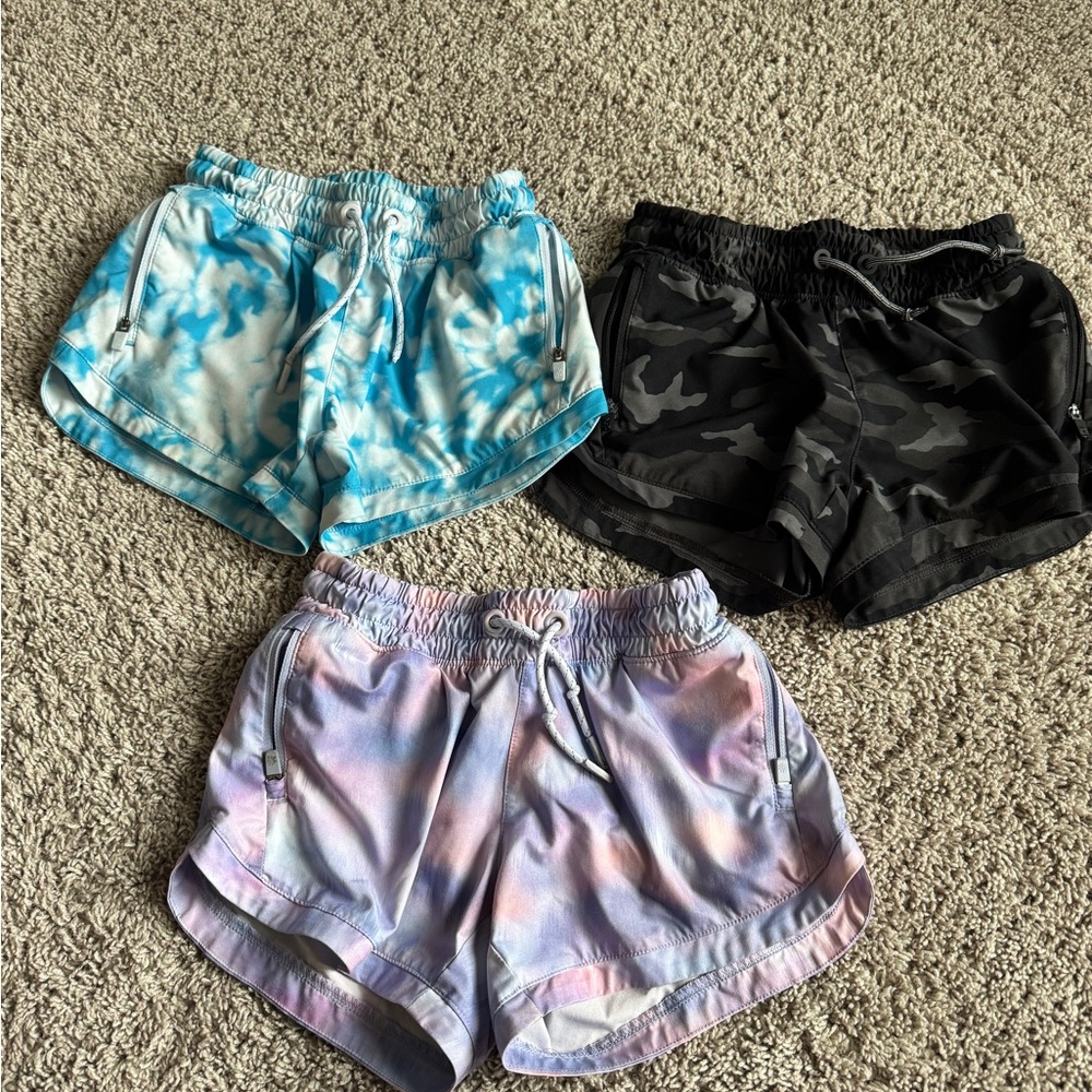 Set of Three Athleta Girl Tie-Dye and Camo Shorts